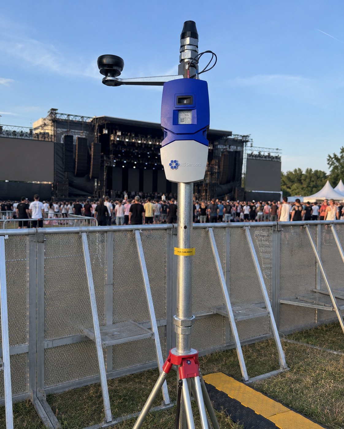 ChemNode mounted on a tripod at a live event, shown at true scale beside the crowd