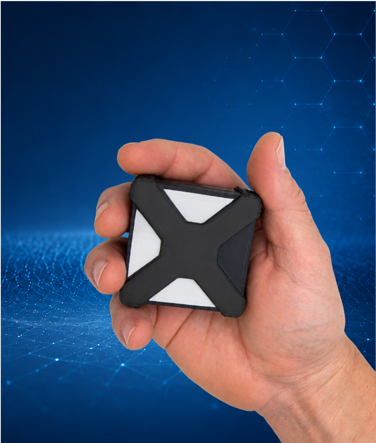 ChemShield sensor node held in one hand, shown at true scale